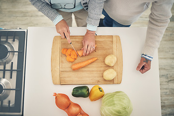 Image showing Cooking, vegetables and couple hands cook food in a kitchen for healthy, vitamins and nutritions diet in a home. Meal, overhead and people preparing fresh produce together on cutting board for dinner