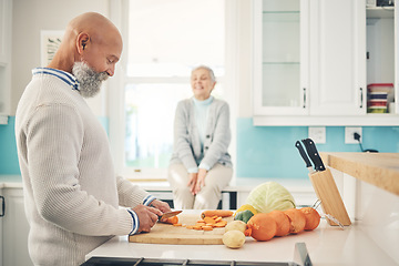 Image showing Cooking, food and a mature couple in the kitchen of their home together during retirement for meal preparation. Health, wellness or nutrition with an old man and woman making supper in their house