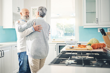 Image showing Dance, love and a senior couple in the kitchen of their home together during retirement for bonding. Happy, smile or romance with a mature man and woman pensioner dancing while having fun in a house