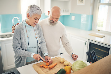 Image showing Cooking, food and an old couple in the kitchen of their home together during retirement for meal preparation. Health, wellness or nutrition with a senior man and woman making supper in their house