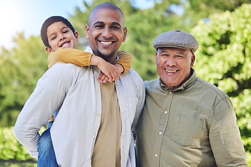 Image showing Father, son and grandfather with generations in park portrait with piggy back, happiness or love on vacation. Men, boy child and hug with bond, excited family or outdoor in summer sunshine on holiday