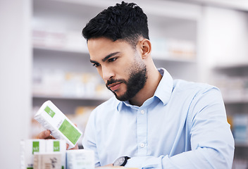 Image showing Pharmacy stock, man and medicine retail check of a customer in a healthcare and wellness store. Medical, inventory and pills label information checking and reading of a male person by a shop shelf