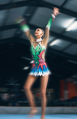 Image showing Woman, gymnastics and motion blur in gym for performance, training and dancer with creativity in contest. Female gymnast, athlete and dance for workout, sports and wellness with balance, art or focus