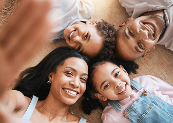 Image showing Family, selfie portrait and top view smile, bonding or having fun together. Parents, happiness above and children relaxing or lying on carpet floor with profile picture, face or enjoying time in home