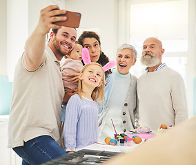 Image showing Easter selfie, big family and smile while painting, holiday bonding and memory together at home. Happy, festive and a father taking a photo with children, mother and senior parents with an activity