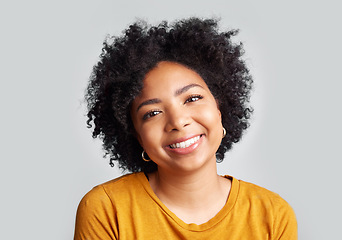 Image showing Portrait, smile and happy woman in studio calm, relax and posing against a grey background space. Face, cheerful and excited African female confident, natural and content, casual and beautiful