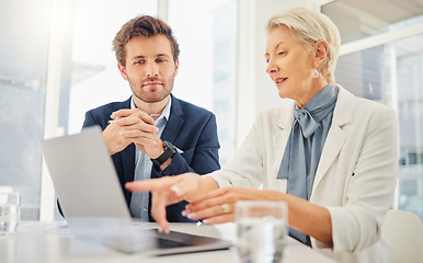 Image showing Office laptop, business people and mentor explaining research data, online sales insight or company system. Teamwork, pointing gesture and senior woman working, teaching or coaching onboarding man