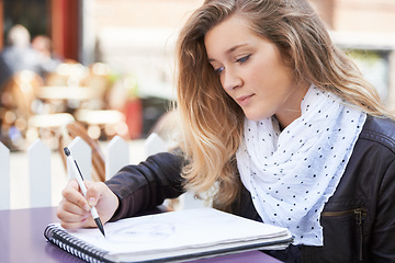 Image showing Drawing, art or woman with a notebook on campus for school creativity, working or learning in college. Artistic or girl student writing or sketching a face on paper for education or university class