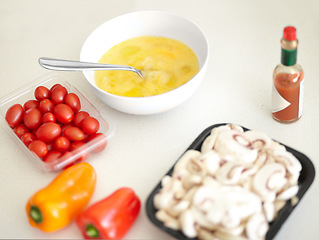 Image showing Cooking preparation, ingredients and breakfast on a counter for health, nutrition and protein. Kitchen, healthy and omelette food, eggs and product on a table in the morning ready to cook for diet