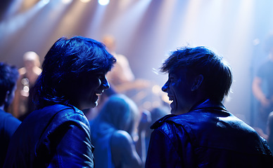 Image showing Excited men, friends and fans at music festival, lights and crowd in silhouette at live band performance on stage. Happiness, people with smile and blue lighting, excitement at rock concert together.