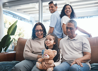 Image showing Big family, house and sofa with grandparents, kid smile and happiness in a living room lounge. Happy, love and parent care of a mom, dad and child with elderly people relax on a couch in a home