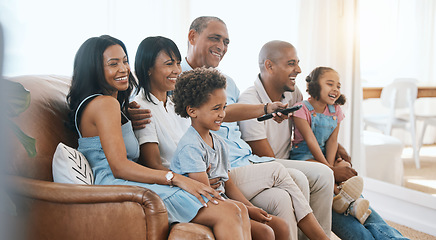 Image showing Happy, big family and watching tv on the sofa together, enjoying a film or comedy show at home. Smile, living room and parents, grandparents and children laughing at the television for happiness