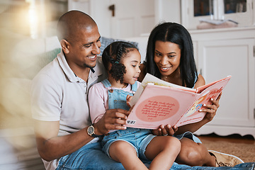 Image showing Love, bonding and family reading a book together before bed in a bedroom in the modern house. Happy, smile and girl kid enjoying a fantasy novel or story with her mother and father in their home.