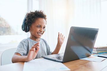 Image showing Happy, remote and a child waving on a video call for education, elearning and online class on laptop. Smile, wave and a student greeting for digital school communication from home on a computer