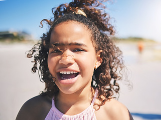 Image showing Child, beach and portrait in nature with a young girl and smile on summer holiday. Face, closeup and African female child at the sea on vacation feeling happy from the ocean and outdoor fun in sun