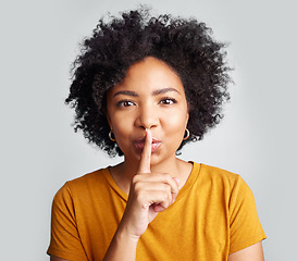 Image showing Portrait, woman and secret with finger on lips for privacy, mystery and noise on white background. Face of female model, silence and shush for quiet, gossip or whisper emoji of confidential surprise