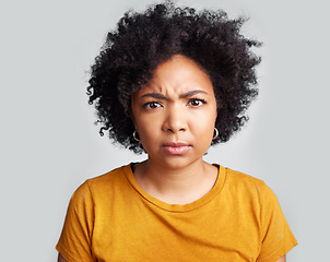 Image showing Confused, portrait and woman in studio, pensive and unsure against a grey background. Doubt, annoyed and face of African female with dont know frown, attitude and angry, doubtful and frustrated