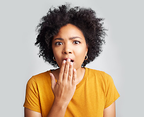 Image showing Surprise, wow and woman covering mouth with hand isolated on a white background in studio. Shocked, face and African female person amazed, omg or surprised reaction to news, emoji or fear portrait