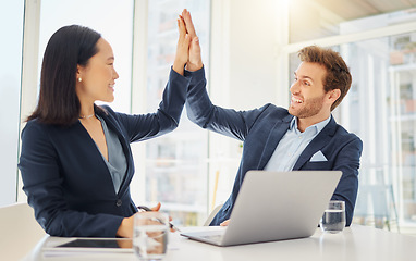 Image showing Business man, woman and high five with laptop, partnership or motivation for teamwork in office. Japanese businesswoman, businessman and computer with diversity, support or celebration for goals