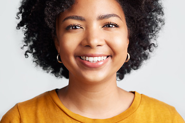 Image showing Happy, woman and portrait of face in studio, white background and backdrop. Confident young african female model smile for natural curly afro hair, positive personality and gen z girl of South Africa