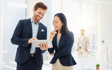 Image showing Business people, teamwork conversation and tablet ideas together in an office. Asian woman employee reading a report review with a businessman while talking and planning a company strategy with data