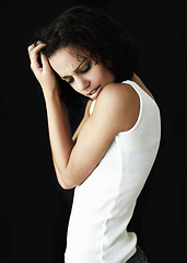 Image showing Depression, dark and woman with mental health problem, anxiety or bipolar isolated in a black studio background. Headache, pain and depressed female person with psychology issue or identity crisis