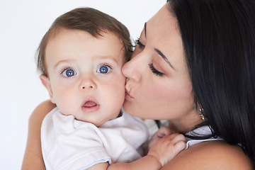 Image showing Happy, kiss and care with mother with baby for bonding, affectionate and growth. Happiness, love and family with face of woman and kissing young child on cheek for cute, sweet and kindness