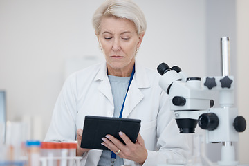 Image showing Tablet, science and woman in laboratory for research or online for medical analysis with scientist results. A person in lab with mobile app for future healthcare, medicine or biotechnology innovation