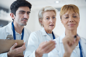 Image showing Doctor, team and writing for healthcare planning, schedule or brainstorming together at hospital. Group of doctors in meeting, collaboration or teamwork for medical strategy, tasks or plan at clinic