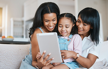 Image showing Family, tablet and child on a children education app with mother and grandparent at home. Happiness, bonding and kid game on technology with a young girl smile from mom and grandmother help on couch