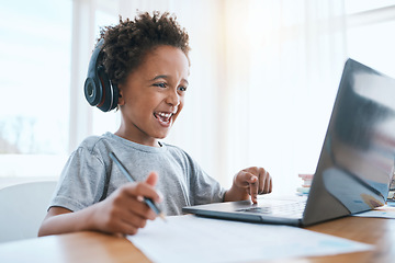 Image showing Learning, laptop and headphones of child for online education, language translation and writing in virtual class. Happy african kid on audio tech, computer and web, streaming and development at home