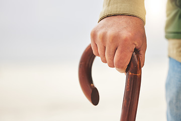 Image showing Hand, senior man with disability and cane or walking stick for support. Injury or osteoarthritis, physical therapy or rehabilitation and elderly patient holding a wooden walk aid in closeup on mockup