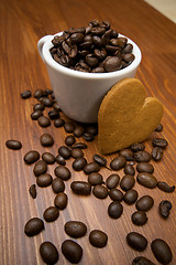 Image showing Gingerbread cookie heart in front of coffee cup