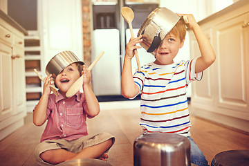 Image showing Funny, pots and playing with children in kitchen for imagination, fantasy and games. Bonding, siblings and happy with kids and kitchenware on floor of family home for music, noise and happiness