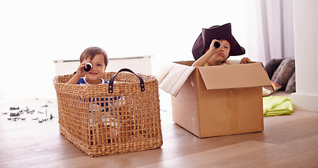 Image showing Fantasy, children smile in costume as pirate and play with boat boxes in living room at their home. Happiness, creative and an adventure game with happy or excited kids pretending to sail on a ship