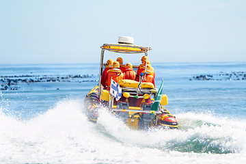 Image showing Rescue team on boat, safety in the ocean and transportation, emergency service with protection in the water. People on sea patrol with back view, search mission and security at the beach with help