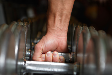 Image showing Hands, dumbbell workout and strong man doing power exercise, club fitness or bodybuilding training. Health commitment, gym equipment and body builder, person or male athlete with steel metal dumbell