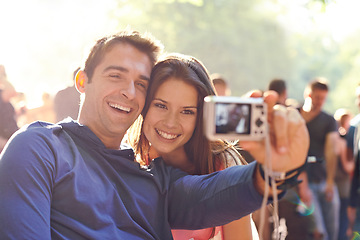 Image showing Happy, selfie and couple outdoor, event and happiness with joy, bonding and quality time. Partners, man and woman with digital camera, picture or memory with joy, outside and relax with smile or care