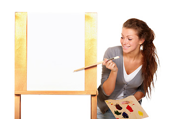 Image showing Art, woman painter and canvas in studio for creativity, talent and paint brush for color. Female artist happy about painting isolated on a white background for creative work, project and mockup space