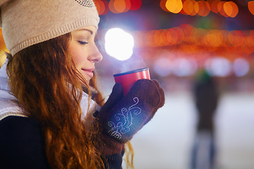 Image showing Woman, ice rink and happy in night with coffee, steam or smell aroma on winter vacation. Girl, happiness or warm drink for cup of matcha, espresso or latte for energy for exercise, fitness or holiday