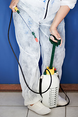 Image showing Pest control, disinfection and biohazard with woman and fumigator for home improvement and treatment in closeup. Risk, protection and health with female exterminator for cleaning, spray and hygiene