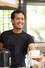 Image showing Coffee shop, barista and a man serving cup as small business, restaurant or startup owner. Smile of a happy entrepreneur man working as a waiter or manager with a drink or tea in a cafeteria or cafe