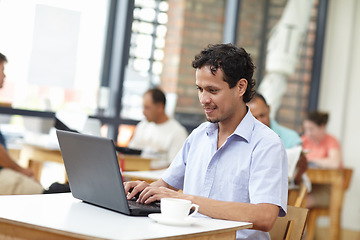 Image showing Student man, laptop and coffee shop with smile, typing or search on internet for job opportunity. Young guy, computer and cafe for reading, happy and social network for news, research or video on web