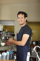 Image showing Coffee machine, barista and smile portrait of a man as small business, restaurant or startup owner. Happy entrepreneur man working as a waiter or manager in a cafeteria, cafe or shop for service