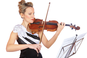 Image showing Art, woman playing violin in studio with sheet music, professional orchestra musician on white background. Focus, talent and classical performance, concert violinist with instrument in black dress.