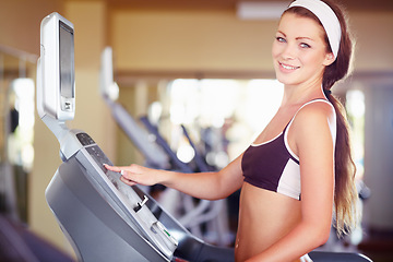 Image showing Woman, gym portrait and treadmill with smile, start button and happy for fitness, wellness and health. Girl runner, running machine and happiness for workout, exercise or training for self care goal