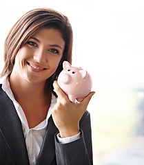 Image showing Business woman, piggybank and portrait with smile for savings, money planning and personal finance goal. Female financial advisor, happiness and small start for banking, investment or building wealth