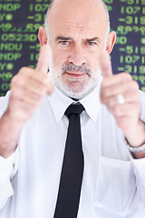 Image showing Stock market portrait, senior man and thumbs up satisfaction for financial crypto, profit or investing revenue. Trading investment numbers, emoji like gesture and business person with economy growth