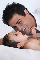 Image showing Baby, laugh and dad on a bedroom bed with happiness, bonding and parent care with smile. Father, happy and young child together in a home playing and kid laughing from papa love and youth support