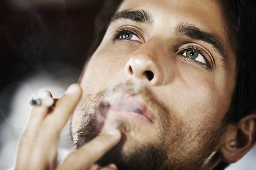 Image showing Thinking, smoke and man with a cigarette, ideas and thoughtful with decision, choices and wonder. Male person, human and model smoking, thoughts and cannabis with a guy, break and relax with fantasy